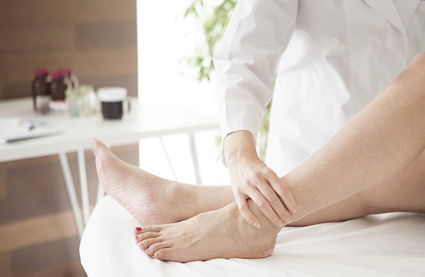 istock Doctor massaging patient's ankle 639878872