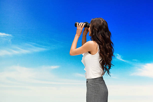 istock Businesswoman searching with binocular 639879150