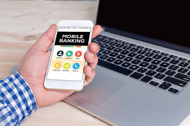 istock Smartphone in hand and showing Mobile Banking concept on screen 639882604
