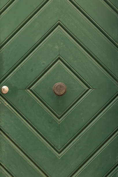 istock Green painted wooden door with diamond pattern 639887644