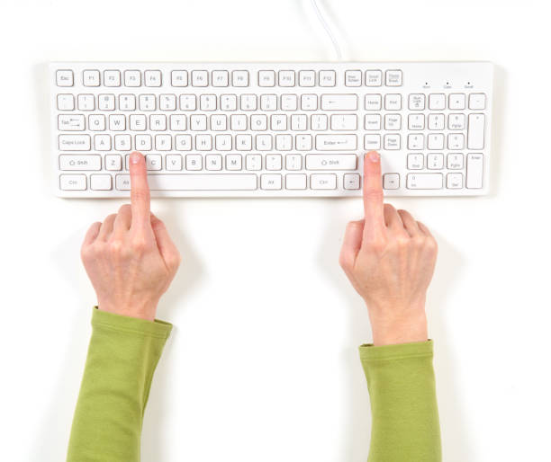 istock Hands in green jacket and white keyboard 639888586