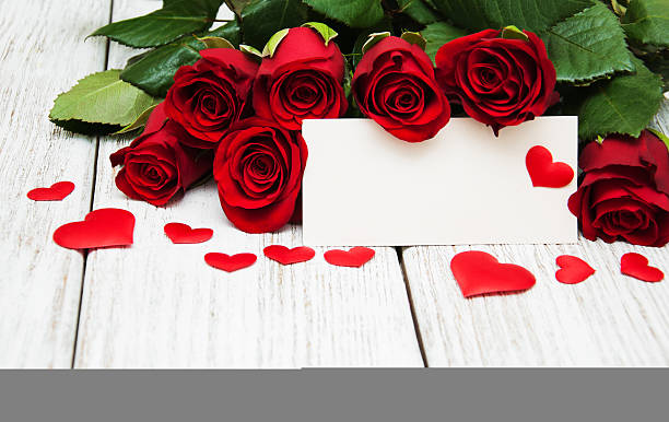 istock Red roses and greeting card 639888778