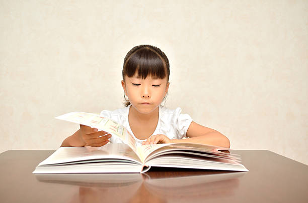 istock Japanese girl reading a book 639888896