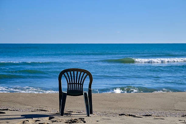 Lonely chair on the sand