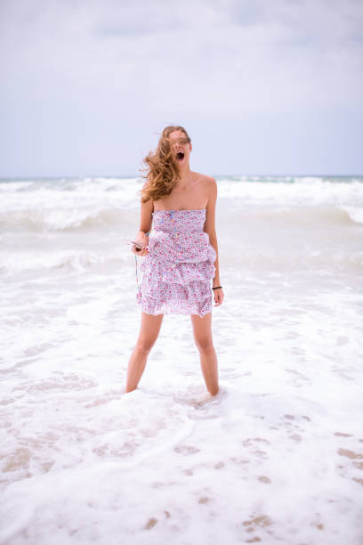 istock Cutel young woman on the beach 639893662