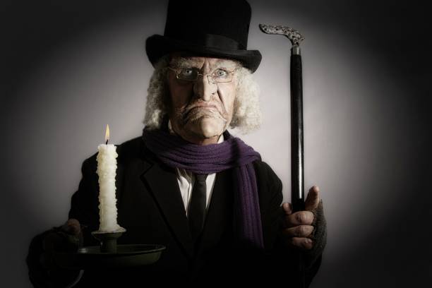 зрелый человек в викторианском костюме - scrooge стоковые фото и изображения