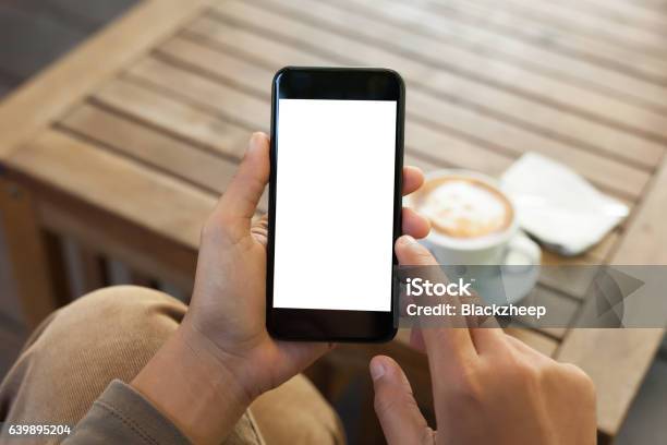 Hand Holding Phone Blank Screen And Finger Touching Stock Photo - Download Image Now