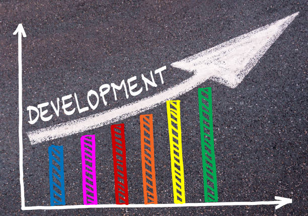 istock Colorful graph drawn over tarmac and directional arrow 639895874