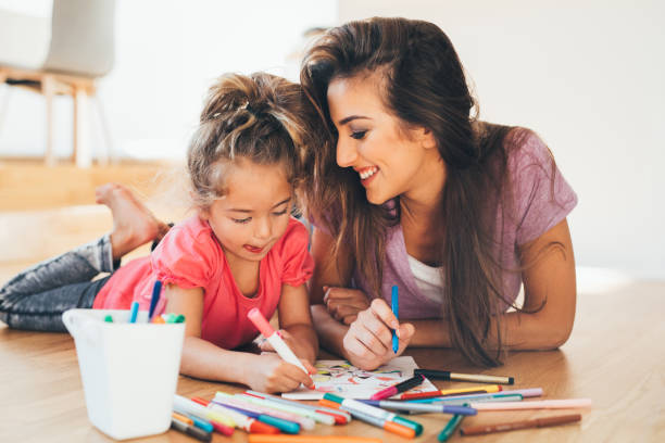 istock Mother and daughter drawing 639896052