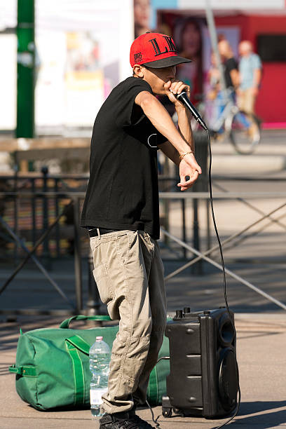 Street Performer of Beatbox - Milan Italy Milan, Italy - September 24th, 2016: A boy beatbox performs in a street of the city center of Milan (Milano). The beatboxing is a form of vocal percussion using mouth, lips, tongue and voice dubstep photos stock pictures, royalty-free photos & images