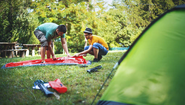 istock Guys setting up a camping tent. 639896966