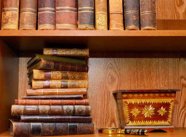 istock Old books, magnifying glass and box 639897140
