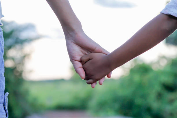 istock kids hand by hand 639897652