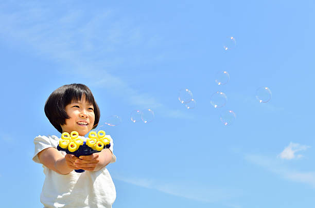 istock Japanese girl with bubble wand 639897930