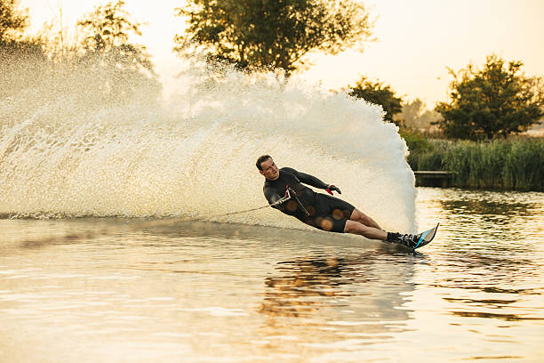 istock Athlete doing stunts on wakeboard in lake 639899898
