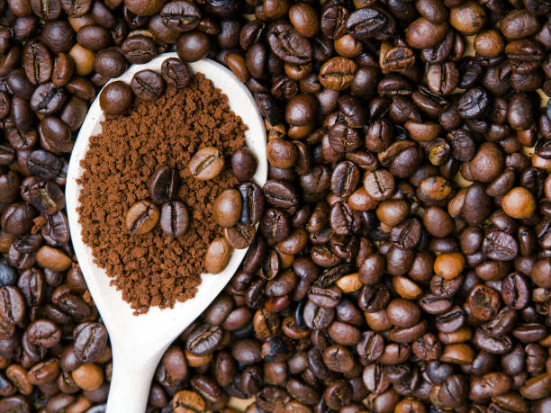 istock Instant coffee in spoon on coffee beans background 639899978