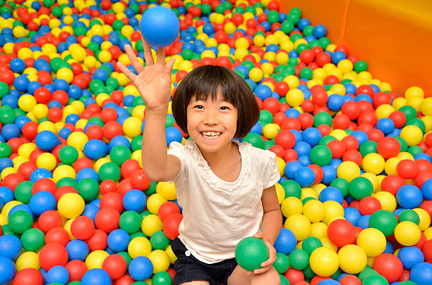 istock Japanese girl with colourful ball 639900478