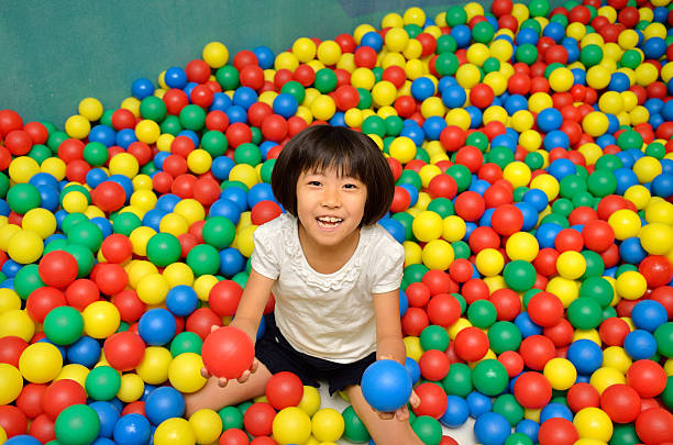 istock Japanese girl with colourful ball 639900580