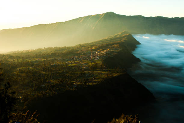 istock Sunrise at volcano Mount Bromo,view of town 639900634