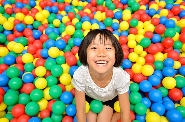 istock Japanese girl with colourful ball 639900736