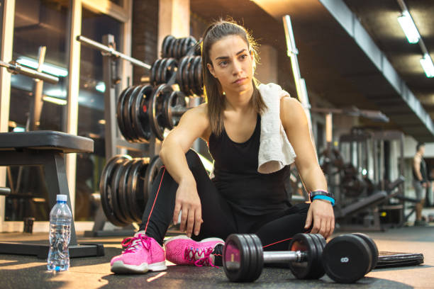 istock Young woman taking a break in a gym. 639901426