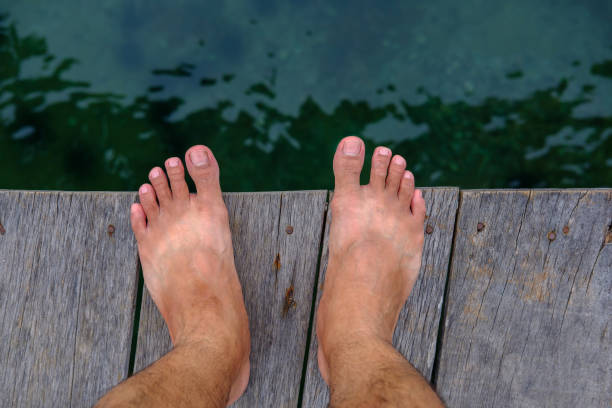 Someone who standing on plank on sea background.