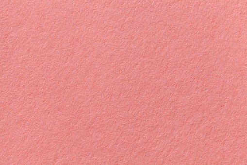 Pink old paper background. Thick cardboard. The texture of carton