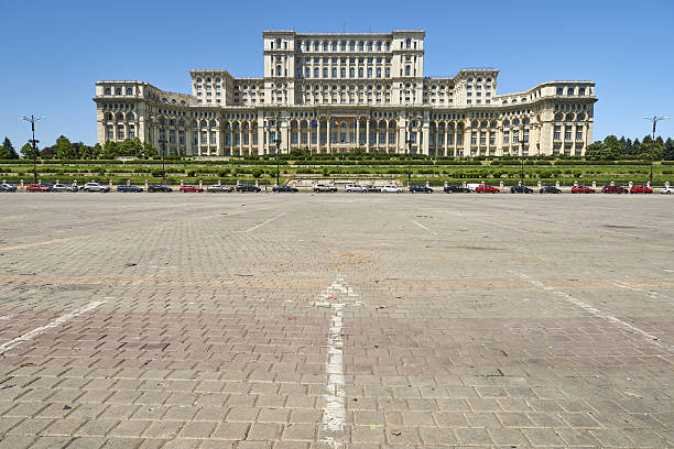 Romania Parliament Palace Bucharest, Romania - June 15, 2016: daytime view of Palace of the Parliament, world's second-largest building. In foreground Piata Constitutiei. editorial architecture famous place local landmark stock pictures, royalty-free photos & images