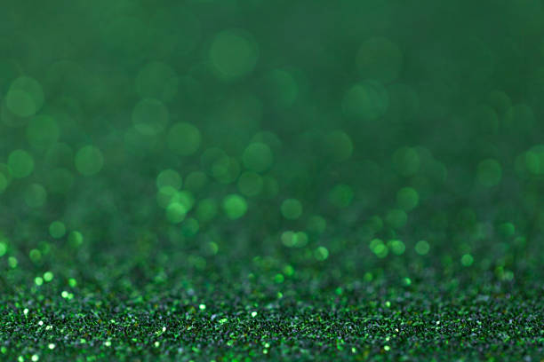 istock Green sparkling background from small sequins, closeup. Brilliant backdrop 639914020