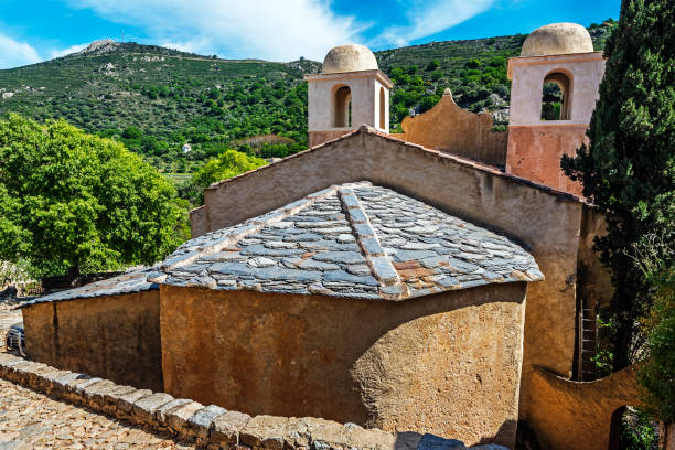 Church of Pigna village in Corsica Island Church of Pigna village in Corsica Island seen from village site, showing details of the Roman tiles Roof, Haute-Corse, France haute corse photos stock pictures, royalty-free photos & images