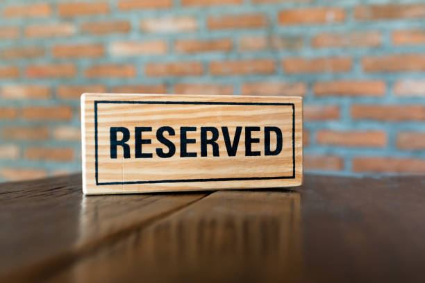 istock reserved sign on a wooden table in a restaurant 639914264