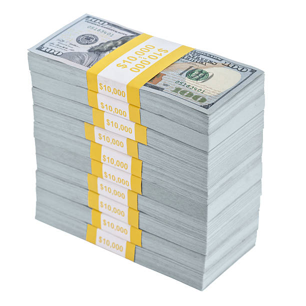 istock Bundles of new U.S. $100 bills stacked on white background 639914528