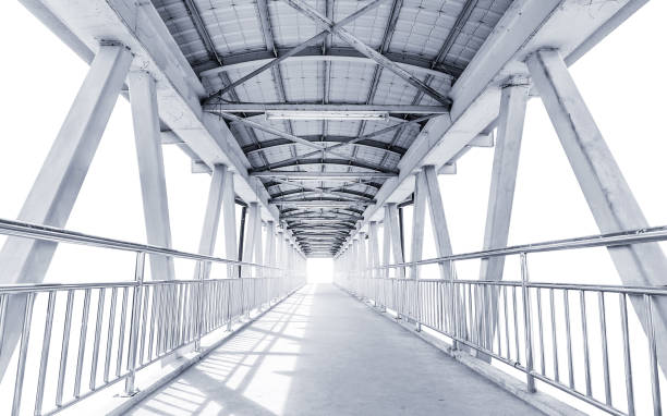 istock Light from the way out of modern metal structure bridge 639915610