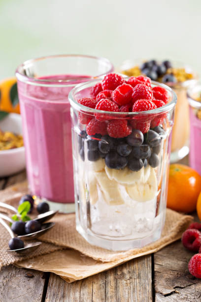 Berry smoothie ingredients in tall glass