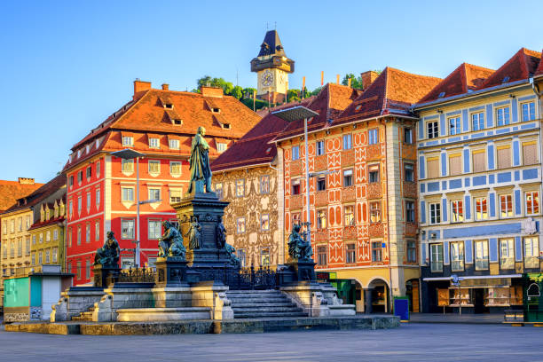 Central square in the Old Town of Graz, Austria Painted facades and the Clocktower in the old town of Graz, Austria are on UNESCO World Cultural Heritage list austrian culture stock pictures, royalty-free photos & images