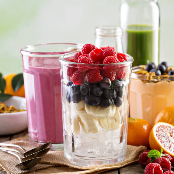 Berry smoothie ingredients in tall glass