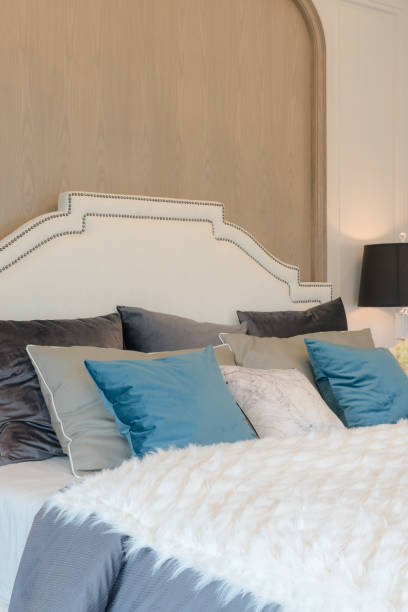 istock luxury bedroom with blue pillows on bed 639918922
