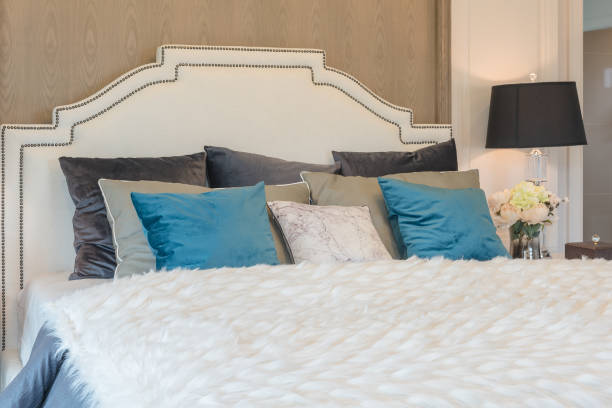 istock luxury bedroom with blue pillows on bed 639918976