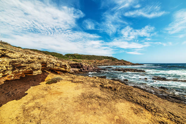 istock yellow rocks and blue sea 639920356