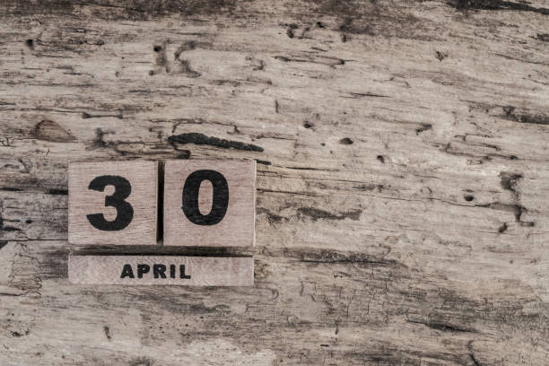 istock Cube calendar for april on wooden background 639922866