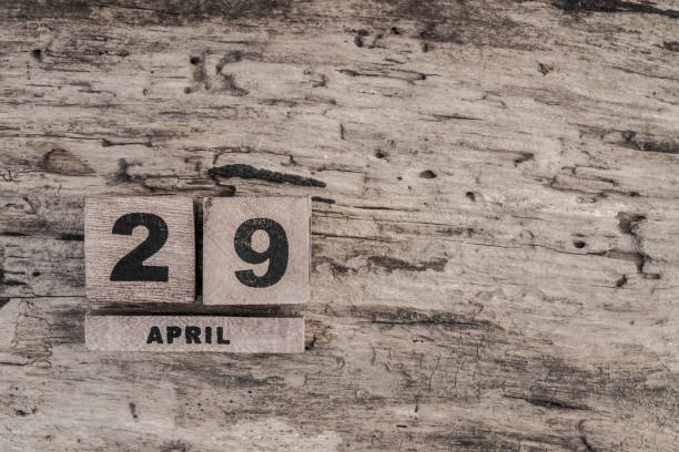 istock Cube calendar for april on wooden background 639922972