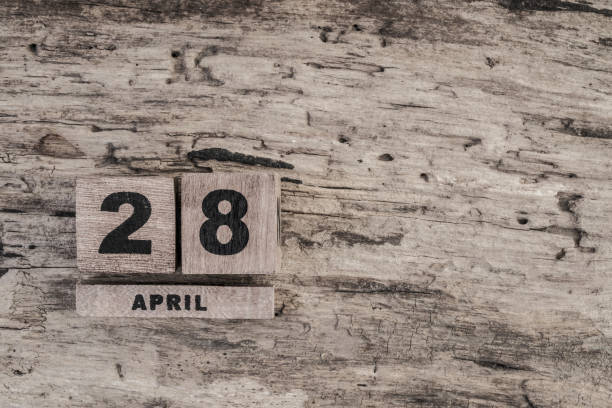 istock Cube calendar for april on wooden background 639923058