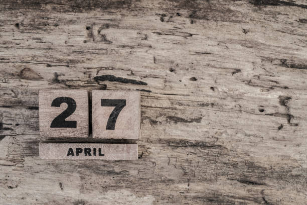 istock Cube calendar for april on wooden background 639923150