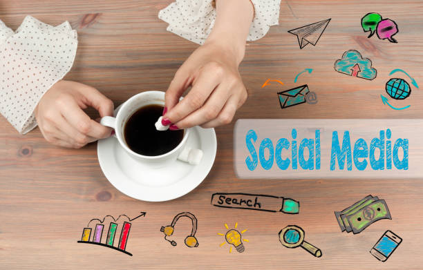 istock Social Media. Coffee cup top view on wooden table background 639923412