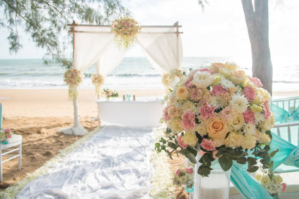 istock Romantic wedding ceremony on the beach under the pines. 639925180