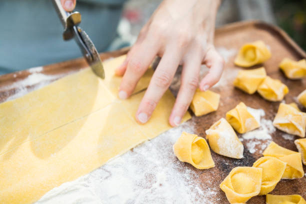 istock chef preparing handmade stuffed pasta tortellini 639925626