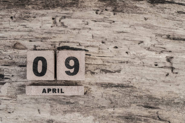 istock Cube calendar for april on wooden background 639925810