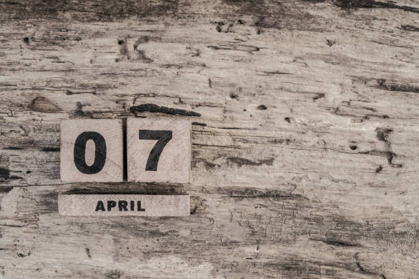 istock Cube calendar for april on wooden background 639926018