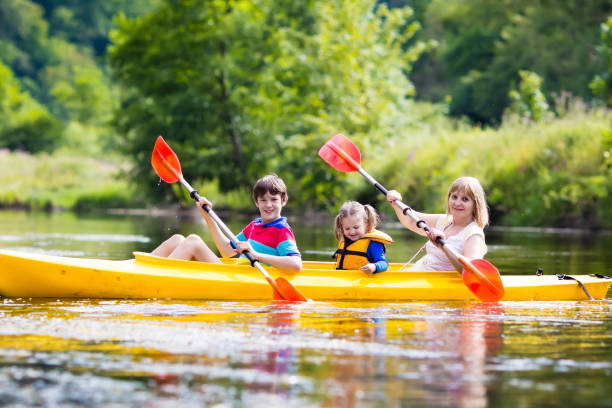 istock Family enjoying kayak ride on a river 639926024