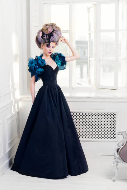 istock Renaissance woman near window 639927254